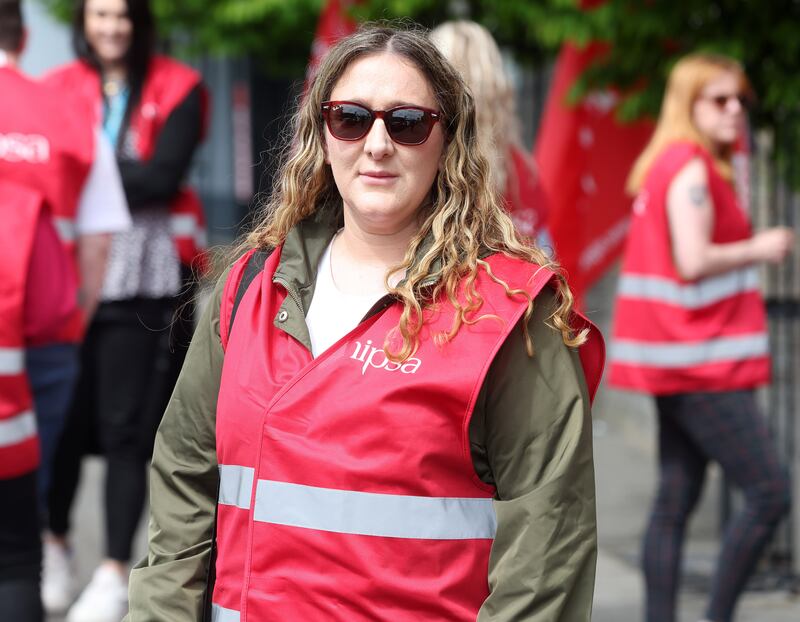 Social worker Gillian Wilson with Nipsa members on strike at the Shankill Wellbeing and Treatment Centre. PICTURE: MAL MCCANN