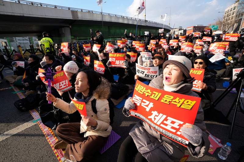 Demonstrators have called for the President to be detained (AP)