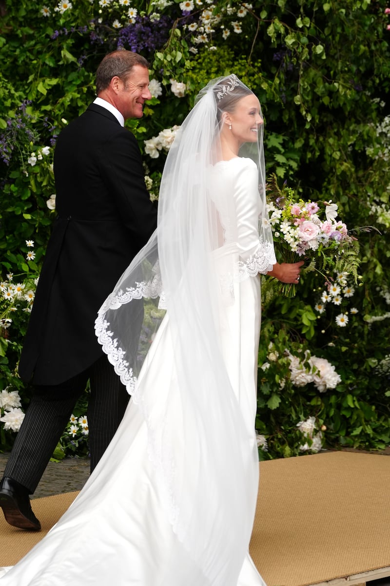 Olivia Henson, with her father Rupert Henson, arrives for her wedding to Hugh Grosvenor, the Duke of Westminster, at Chester Cathedral