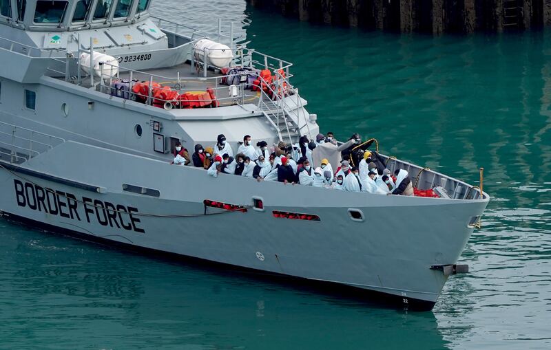 A group of people thought to be migrants are brought in to Dover in Kent, on board Border Force vessel Searcher following a small boat incident in the Channel