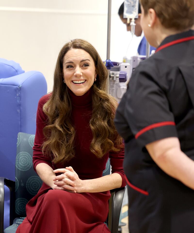 Kate smiles as she chats to staff during a visit to the Royal Marsden Hospital