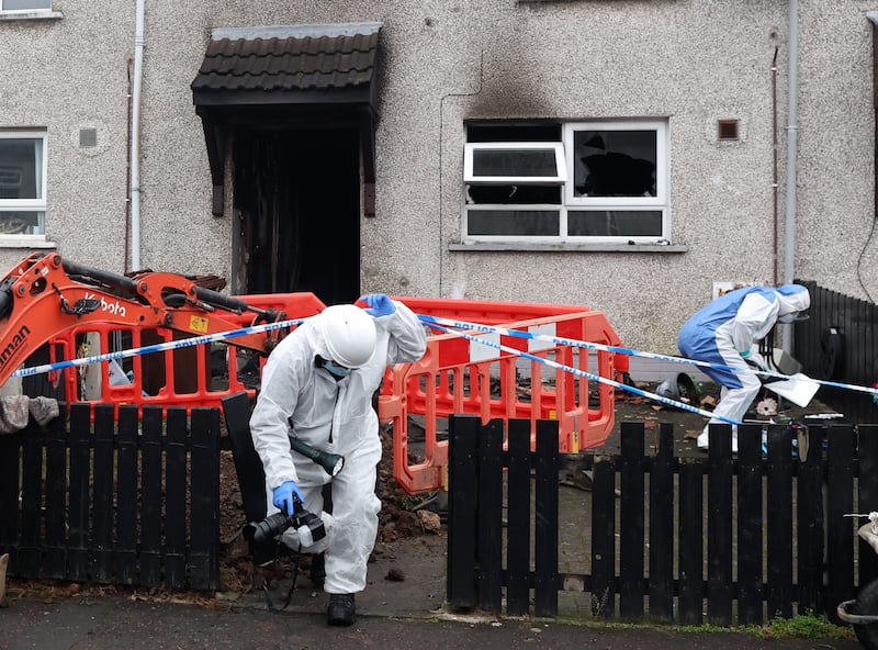 Forensics at the scene after A woman in her 70s had to be rescued by firefighters after her house was ‘set alight’ in a suspected arson attack in Antrim.

The woman was then taken to hospital for treatment to burn injuries to her hands and smoke inhalation following the incident, which took place in the Rathglynn area in the early hours of Tuesday morning.
PICTURE COLM LENAGHAN