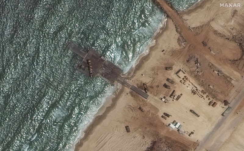 A satellite image of the remaining section of the temporary pier off Gaza (Maxar Technologies/AP)