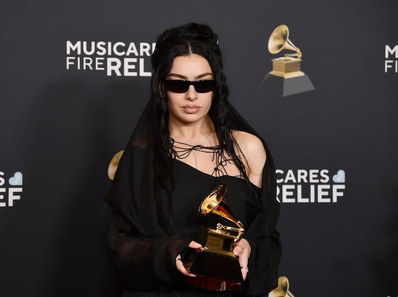 Charli XCX poses in the press room with the award for best pop dance recording for Von Dutch (Richard Shotwell/Invision/AP)