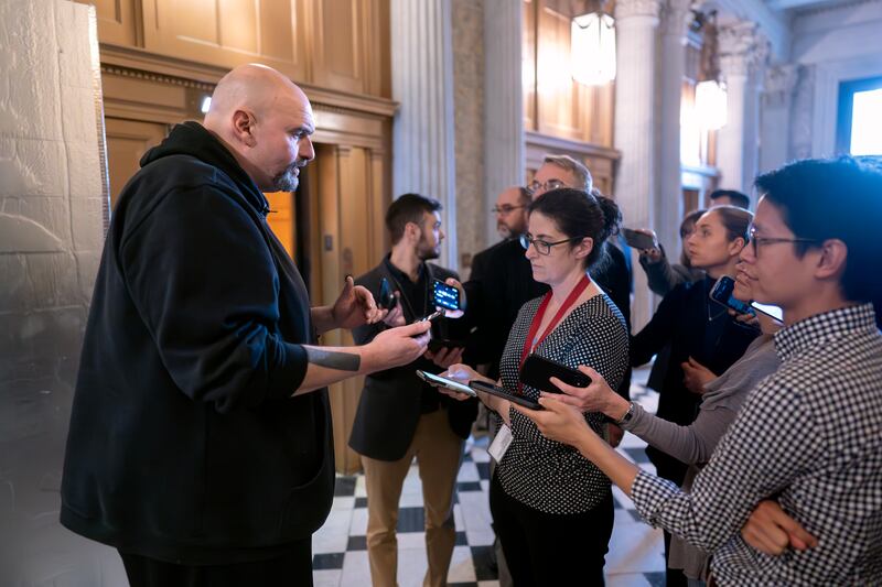 Senator John Fetterman, speaks to reporters as the Senate prepared the procedural vote on the emergency spending package (J. Scott Applewhite/AP)