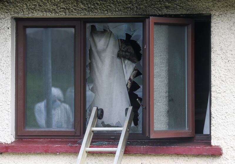 Forensics at the scene  of a house fire in the Cunninghams Lane area of Dungannon.
PICTURE COLM LENAGHAN