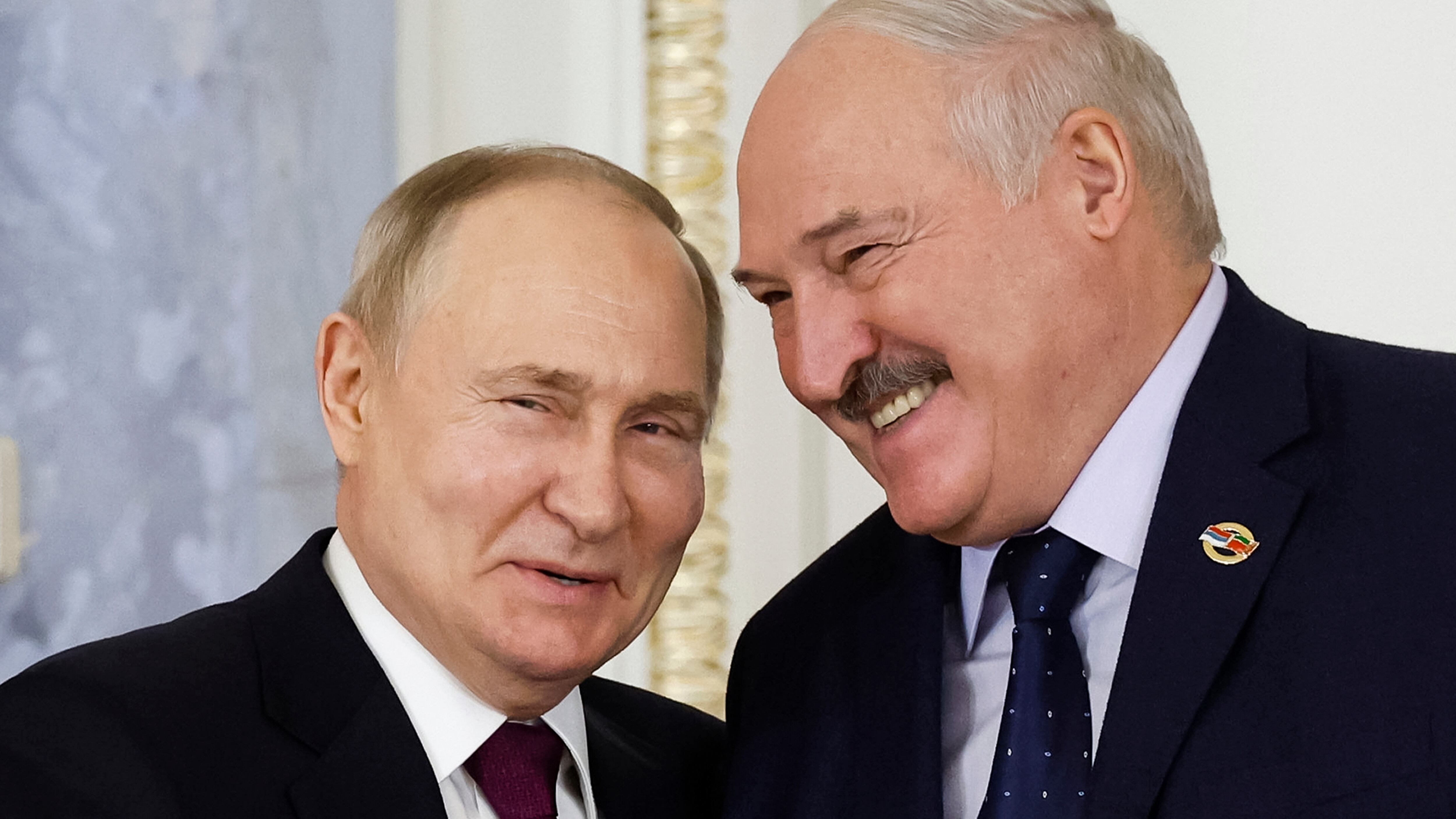 Russian President Vladimir Putin and Belarus President Alexander Lukashenko shake hands during a meeting of the Union State Supreme Council in St Petersburg, Russia, on Monday (Dmitry Astakhov, Sputnik, Government Pool Photo via AP)