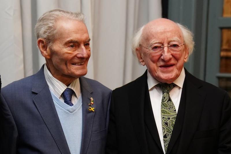 Irish President Michael D Higgins with Holocaust survivor Tomi Reichenthal as they arrive at a Holocaust Memorial Day event at the Mansion House in Dublin