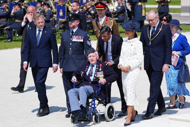 Prime Minister Rishi Sunak and wife Akshata Murty with RAF veteran Bernard Morgan, 100, from Crewe, Defence Minister Grant Shapps (left) and national chairman, Royal British Legion, Jason Coward (right) at the end of the UK national commemorative event for the 80th anniversary of D-Day, held at the British Normandy Memorial in Ver-sur-Mer, Normandy