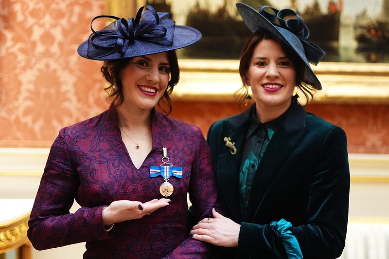 Georgia Laurie (left), with her sister Melissa, after she was decorated with the King’s Gallantry Medal by the King