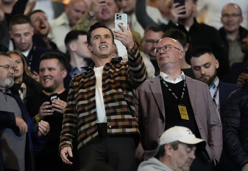 Wrexham co-owner Rob McElhenney with director Shaun Harvey in the stands.