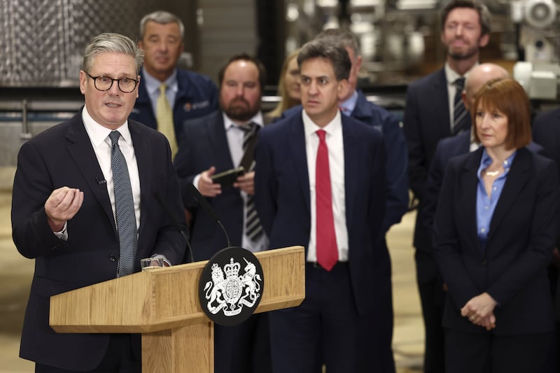 Prime Minister Keir Starmer speaks as Chancellor Rachel Reeves and Energy Secretary Ed Miliband listen during a visit to a manufacturing facility in Chester