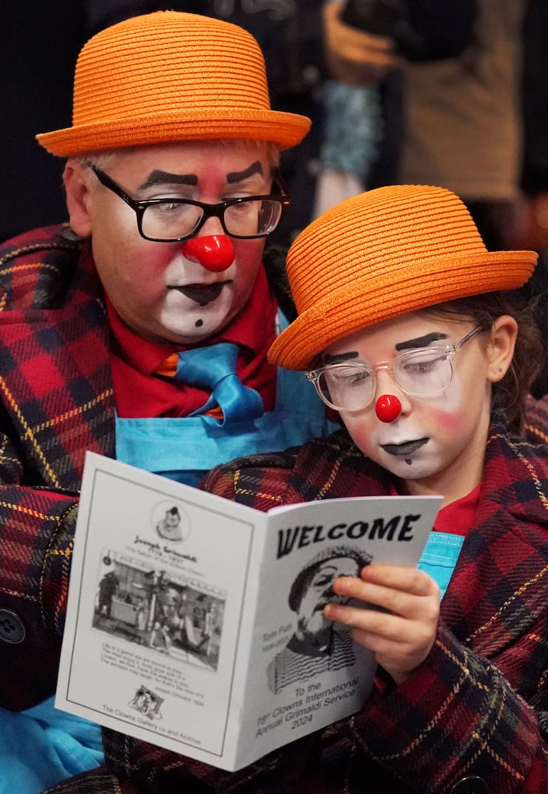 A pair of clowns wearing matching outfits