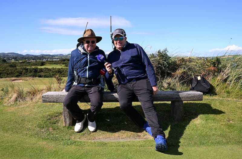 On-course commentators Wayne Riley and Anthony Wall pose for a photo on the eighth tee during day one at Royal County Down Golf Club. Picture by Ross Kinnaird/Getty Images