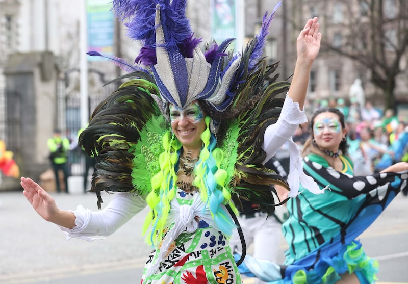 Performers entertain the crowd as  Thousands line the streets for the St Patrick’s day Parade in Belfast on Sunday.
PICTURE COLM LENAGHAN