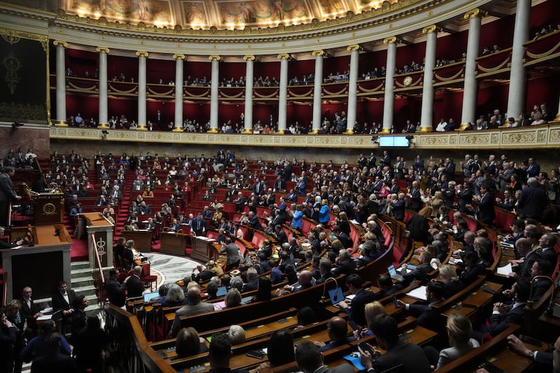 Lawmakers convene at the National Assembly in Paris during a debate and prior to a no-confidence vote (AP Photo/Michel Euler)