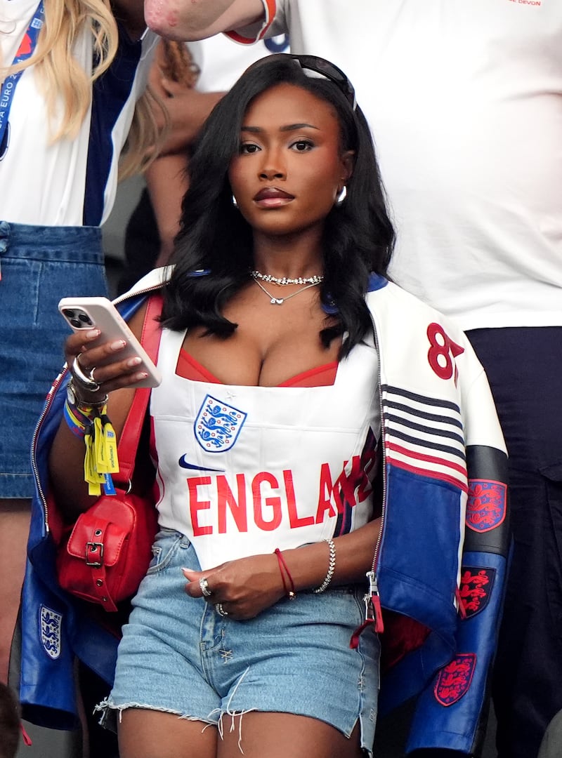 Tolami Benson accented her England football look with a sheer red bralette