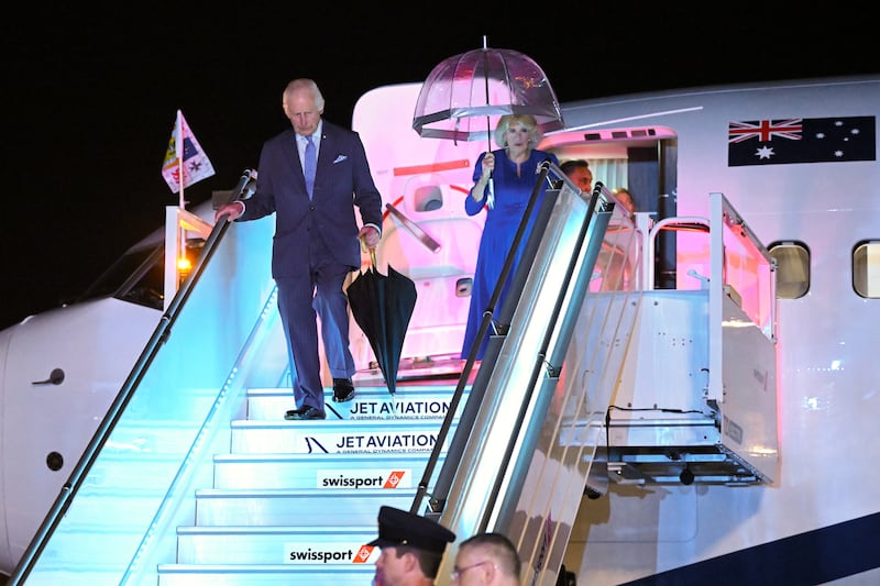 Charles and Camilla arrive in Sydney just after a torrential shower