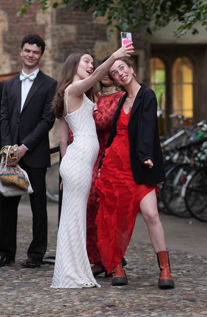 Students from Cambridge University queue up for the Trinity May Ball