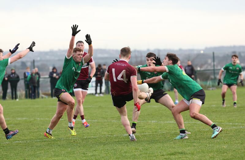 St Mary’s Niall McKenna scores a point during Sundays Sigerson Cup game at Davitt Park in Belfast.
PICTURE COLM LENAGHAN