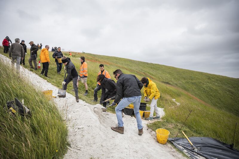 People ‘rechalking’ the White Horse