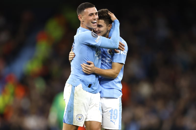 Phil Foden, left, and Julian Alvarez played more than 70 matches each for club and country last season