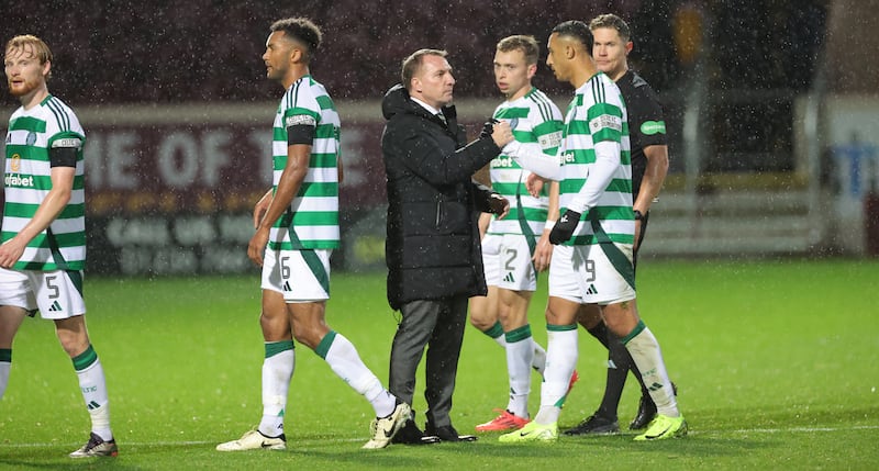 Celtic manager Brendan Rodgers with Adam Idah following the game at Fir Park