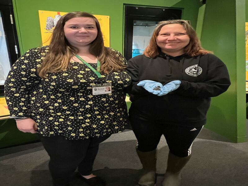 (from left to right) Megan Gard and Sarah Brackstone holding her find