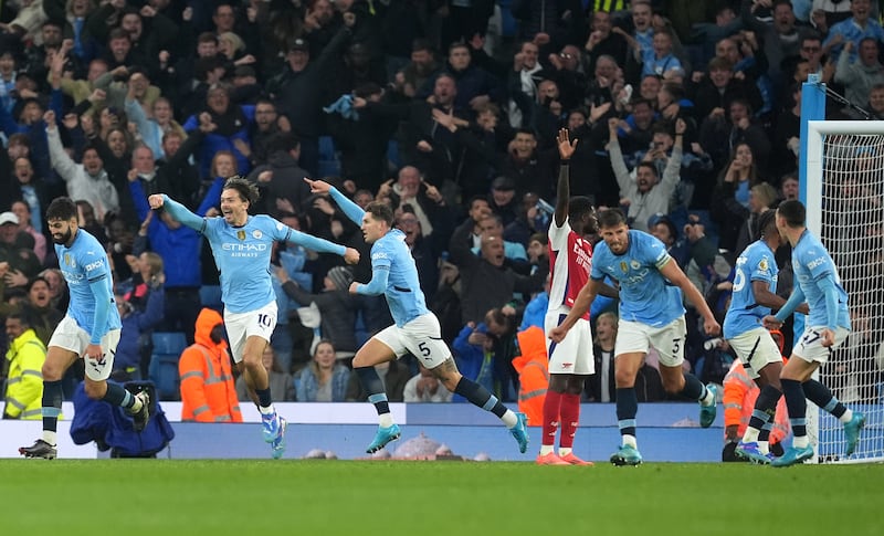 John Stones (centre) salvaged a draw for Man City