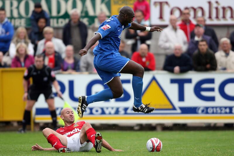 Morecambe’s Paul Mullins and Notts County’s Sol Campbell during the latter’s sole appearance for the Magpies in 2009