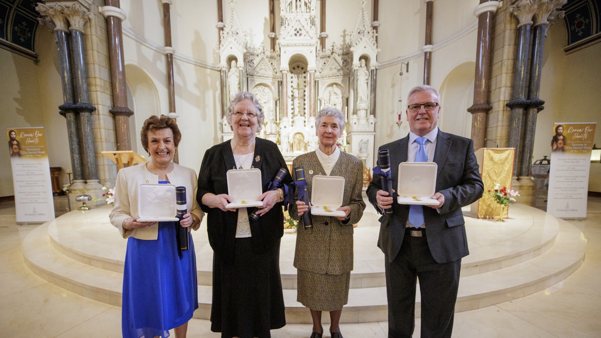 Pictured receiving their Papal Medal last week in St Patrick's Church, Donegall Street, (l-r) were Rita Goldsmith, Sr Mary Carlin, Sr Teresa O'Neill and Brian White.
