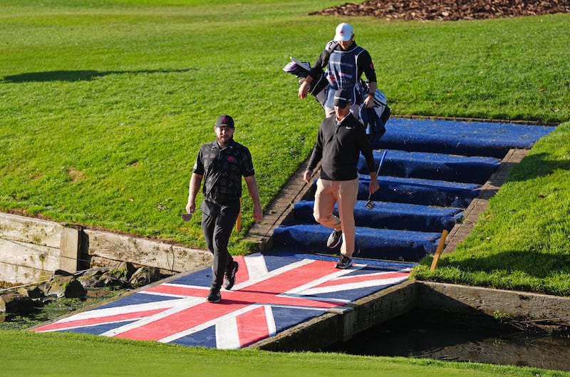 Tyrrell Hatton and Guido Migliozzi make their way on to the 10th green during day two of the Betfred British Masters at The Belfry