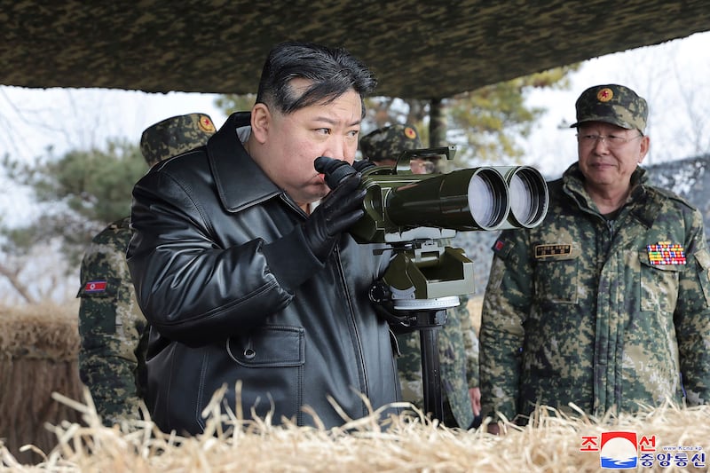 Photo provided by the North Korean government showing leader Kim Jong Un, left, supervising artillery firing drills (Korean Central News Agency/Korea News Service/AP)