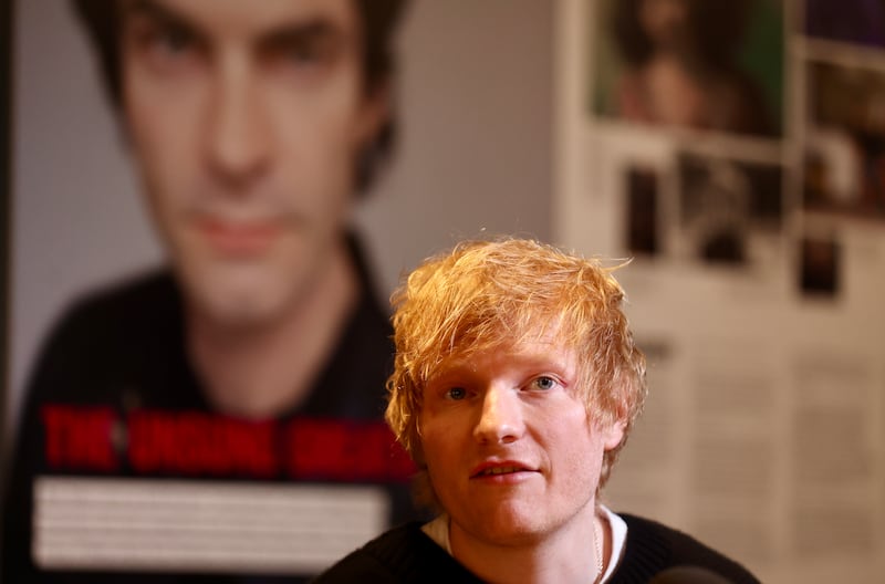 Ed Sheeran and Gary Lightbody  with Charlotte Dryden  who speak to the media at the Oh Yea Centre during a visit to Belfast.
PICTURE COLM LENAGHAN