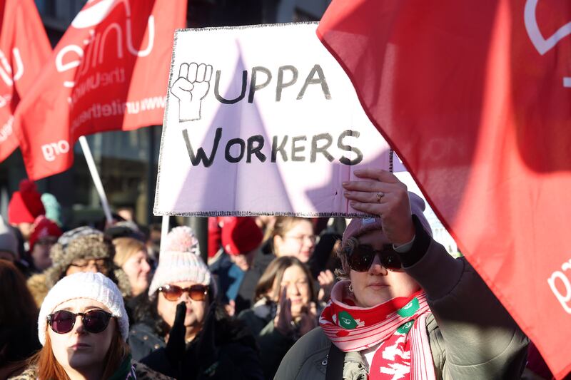 Public sector workers who are on strike gather at the Belfast City Hall for a rally. PICTURE MAL MCCANN