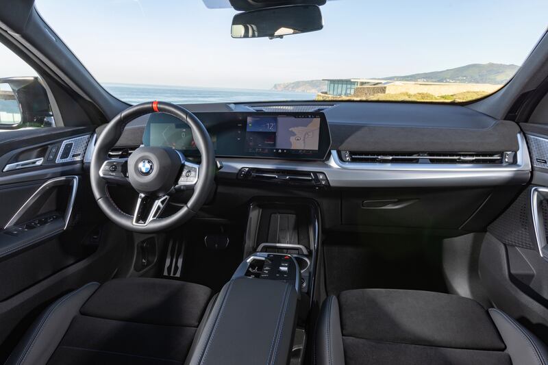 The interior uses the same curved display as many of BMW’s latest models
