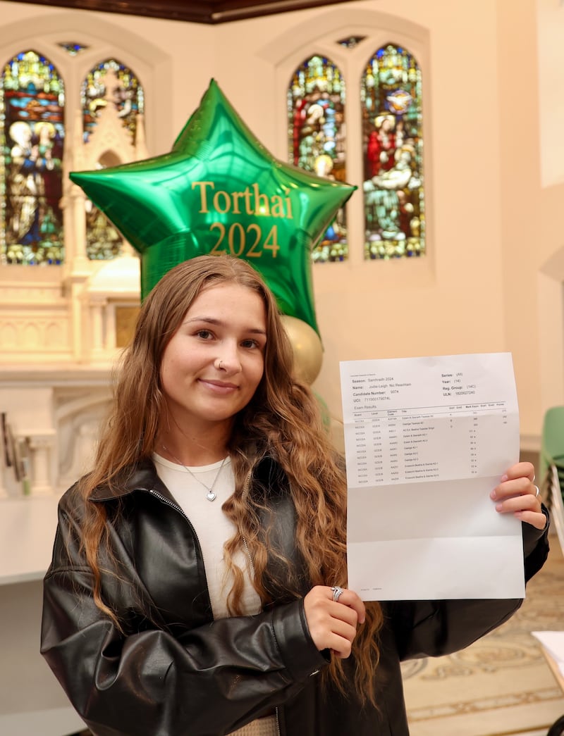 Jodie McCracken from Colaiste Feirste receives her A Level results.
PICTURE COLM LENAGHAN