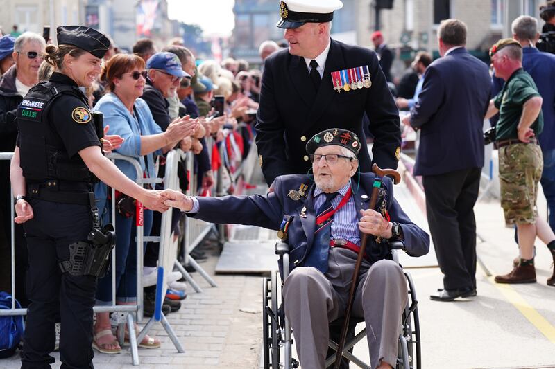 Veterans are greeted by crowds on the seafront in Arromanches, in Normandy, France, on the 80th anniversary of the D-Day landings