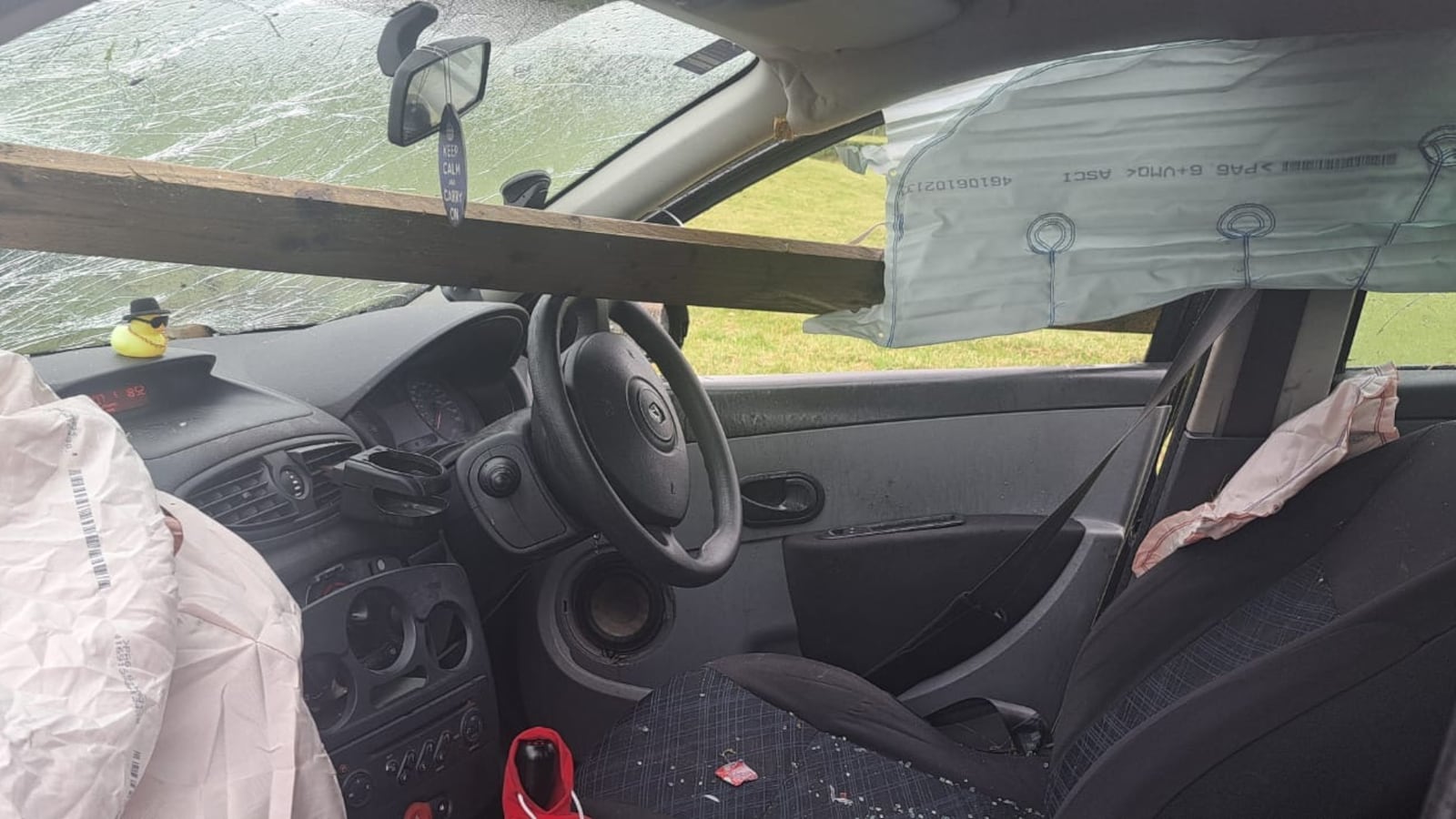 A plank of wood sticks through a car windscreen following a crash on Sunday. PICTURE: PSNI