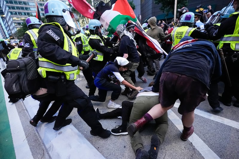 Demonstrators clash with police near the Israeli Consulate during the Democratic National Convention in Chicago. (Frank Franklin II/AP)