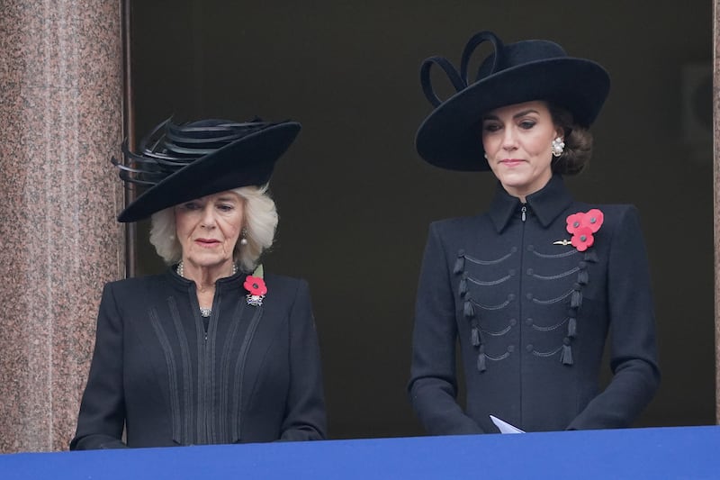 The Queen and Princess of Wales on a balcony overlooking the Cenotaph during the Remembrance Sunday service in 2023