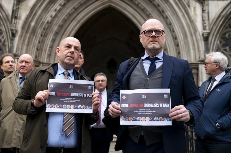 Journalists Barry McCaffrey and Trevor Birney outside the Royal Courts of Justice ahead of the specialist tribunal hearing