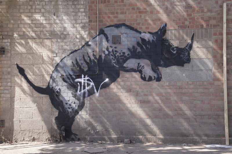 The now defaced artwork unveiled by Banksy on Monday