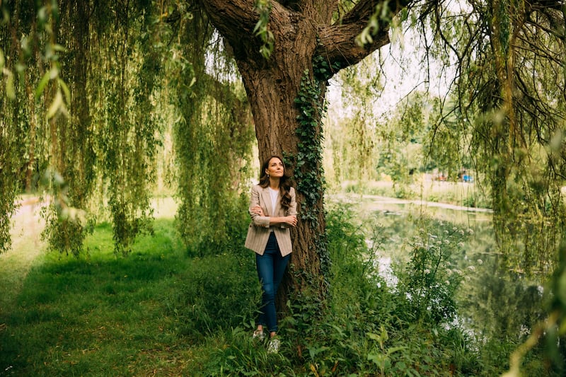 The Princess of Wales leaning on a willow tree in an image released to accompany her update in June