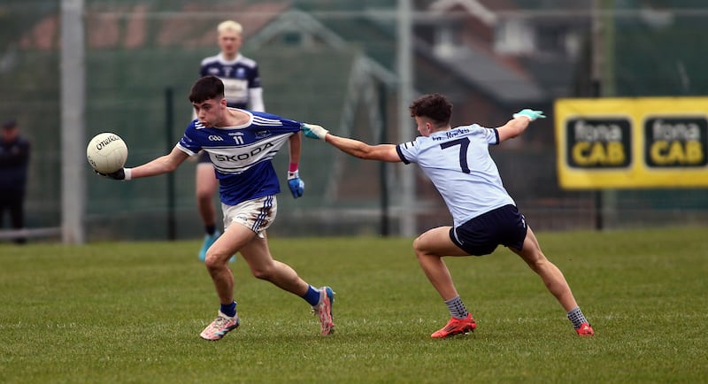 26/12/2024   Fourmasters  Turlough  Carr     in action with  Cookstowns  Michael Lennon     in yesterdays  Semi Final game at St Pauls Gac  Picture   Seamus Loughran