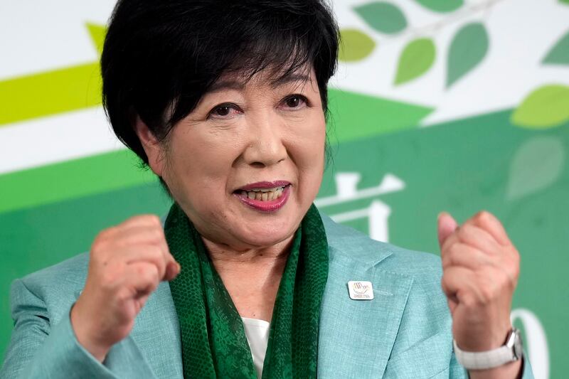 Incumbent Tokyo Governor Yuriko Koike celebrates after the exit poll came in (Hiro Komae/AP)