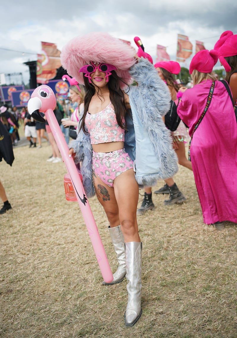 Festivalgoer Saira Biruta dressed in a flamingo costume at the Glastonbury Festival