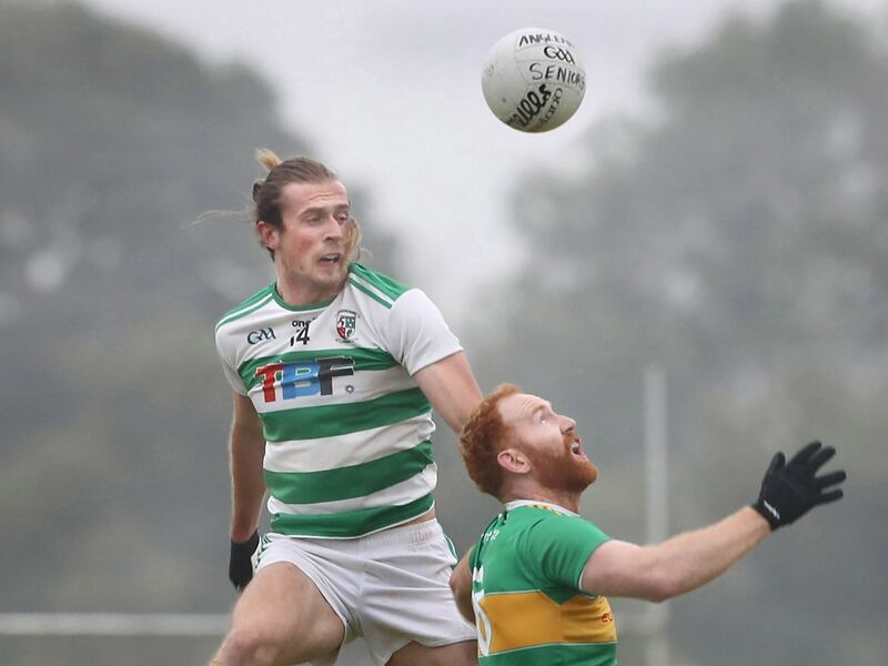 Swatragh's Anton Tohill and Glen's Conor Glass do aerial battle at Davitt Park on Sunday night. Picture by Margaret McLaughlin