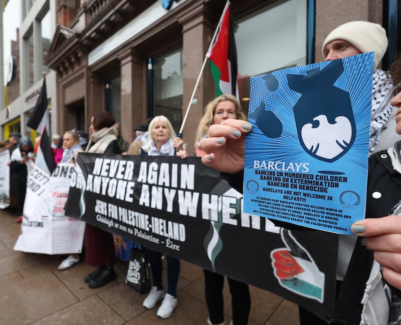 Supporters of the Palestinian people hold a protest at Barclays Bank in Belfast City centre on Saturday.
PICTURE COLM LENAGHAN