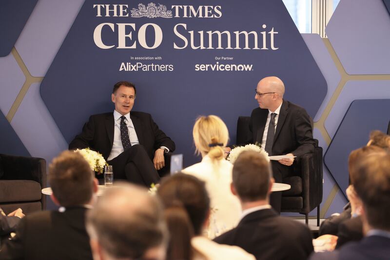 Chancellor Jeremy Hunt, left, speaking during the Times CEO Summit 2024 in London